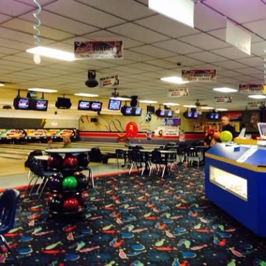 Inside Penny Jo's — seating area, ball racks, and lanes