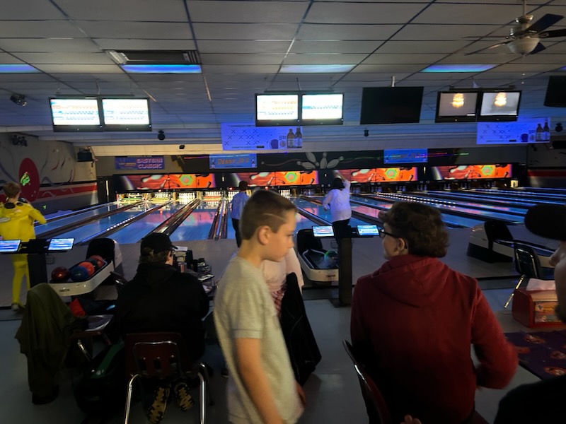 Glow bowling night with neon-lit lanes